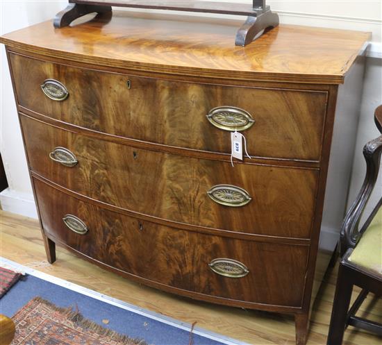 An early 19th century bow-fronted mahogany three drawer chest W.109cm